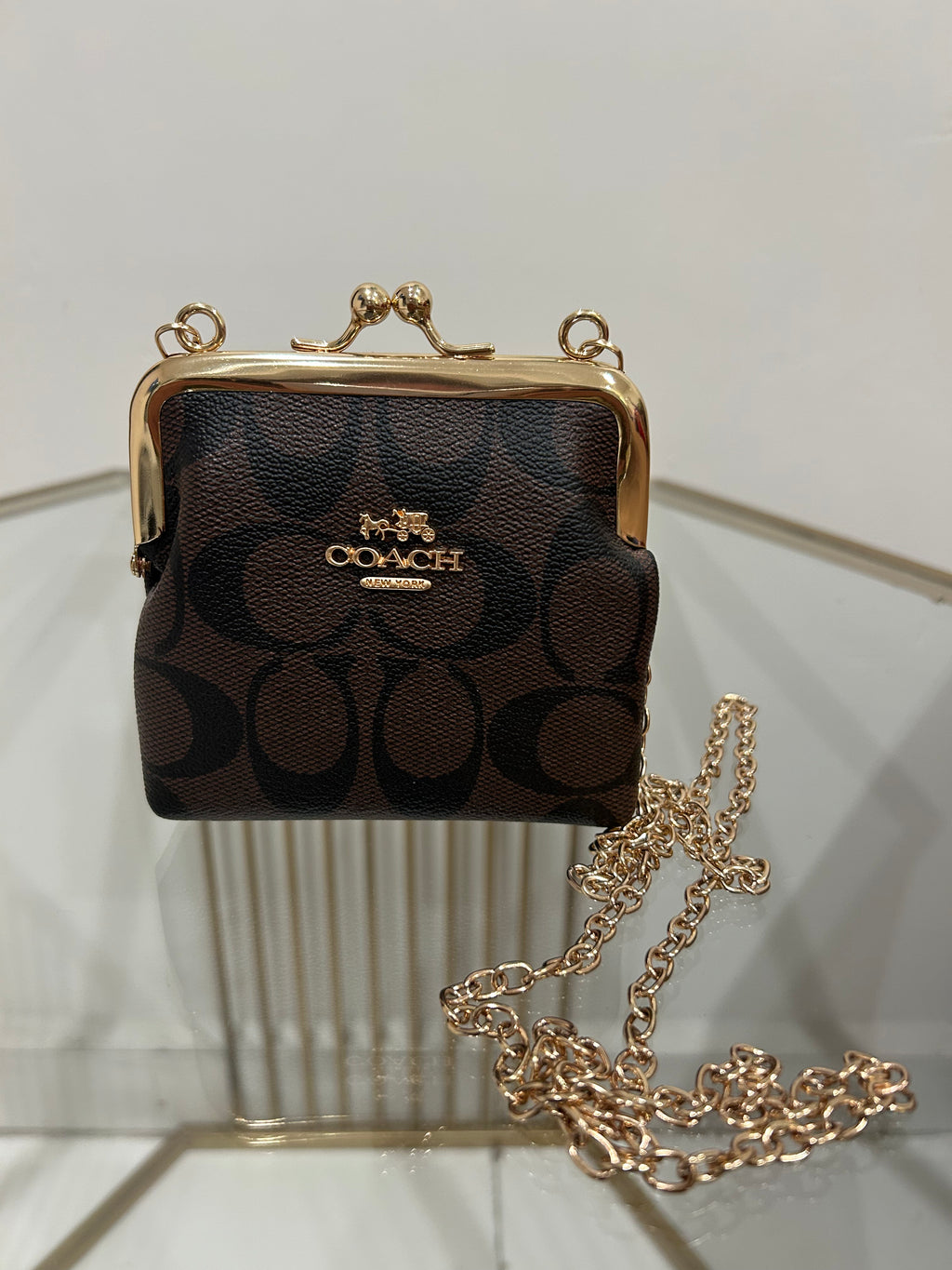 Monedero estilo Coach lona marrón