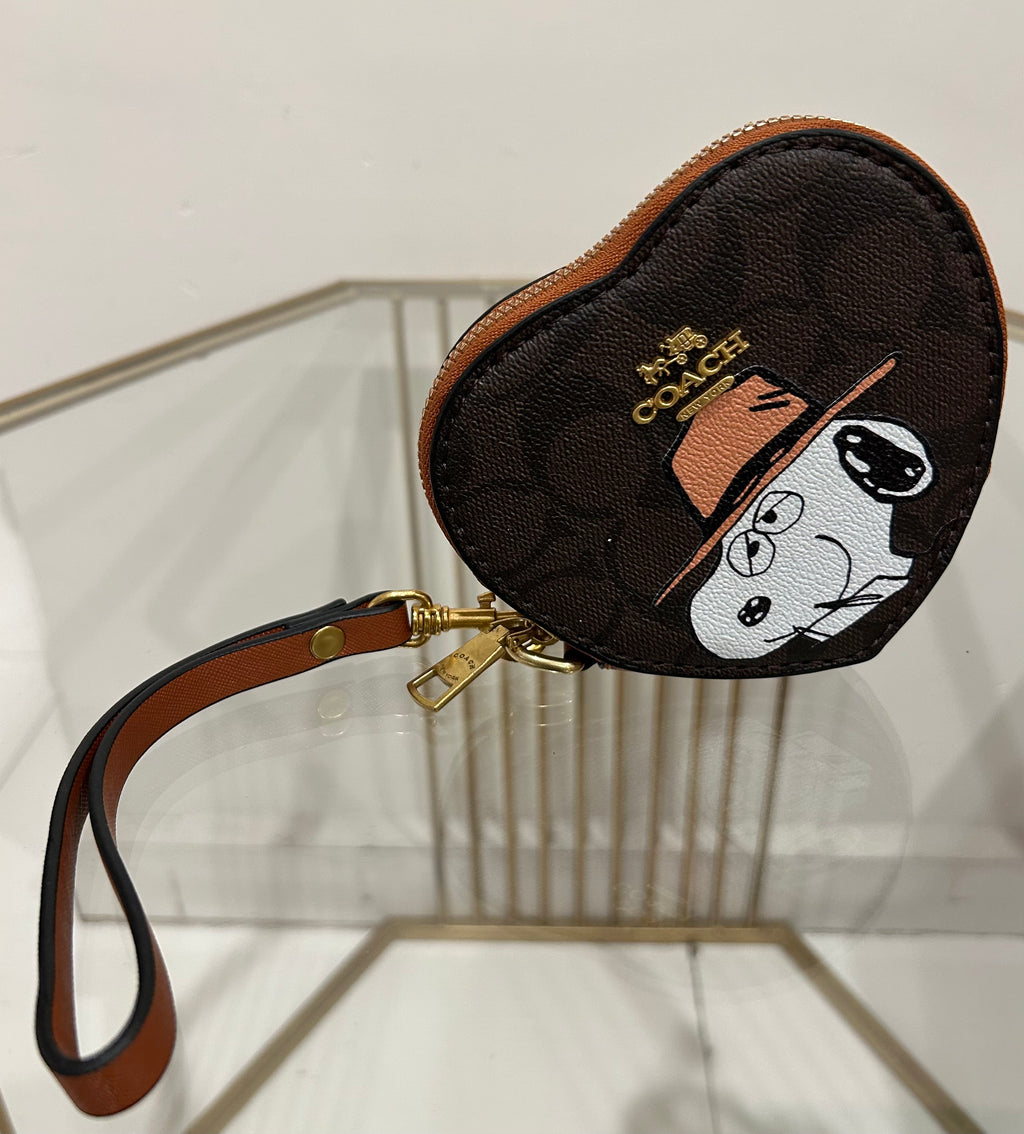 Monedero estilo Coach con estampado Snoopy en lona marrón