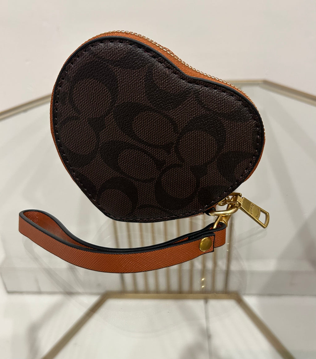 Monedero estilo Coach con estampado Snoopy en lona marrón