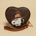 Monedero estilo Coach con estampado Snoopy en lona marrón
