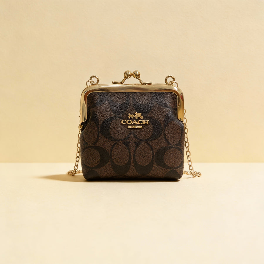 Monedero estilo Coach lona marrón